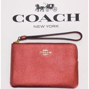 Shiny Red Coach wristlet never been used before!
